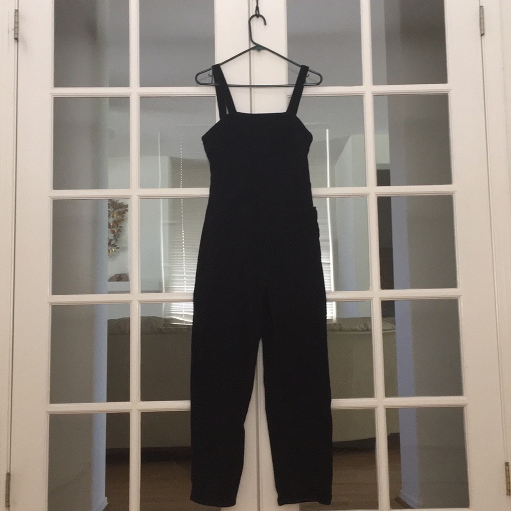 Black corduroy jumpsuit with 2 finger-width straps